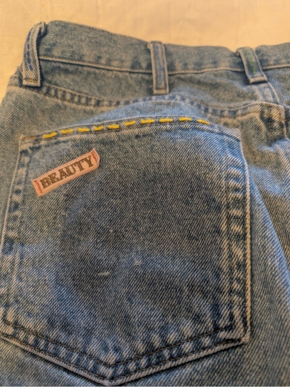 Wrangler light blue denim jeans with pink patch